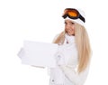 Young woman in ski glasses with empty board for the text Royalty Free Stock Photo