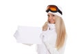 Young woman in ski glasses with empty board for the text Royalty Free Stock Photo