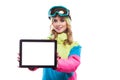 Young woman in ski suit hold empty tablet Royalty Free Stock Photo