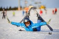 Young woman skier after the fall on mountain slope Royalty Free Stock Photo