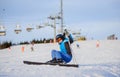 Young woman skier after the fall on mountain slope Royalty Free Stock Photo