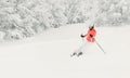 Young woman skier skiing fast downhill on ski slope Royalty Free Stock Photo