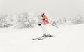 Young woman skier skiing fast downhill on ski slope Royalty Free Stock Photo