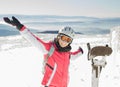 Young woman skier at ski resort in mountains Royalty Free Stock Photo