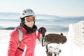 Young woman skier at ski resort in mountains Royalty Free Stock Photo