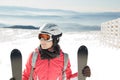 Young woman skier at ski resort in mountains Royalty Free Stock Photo