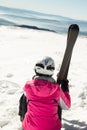 Young woman skier at ski resort in mountains Royalty Free Stock Photo