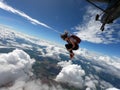 Young woman skydiver jumping from the plane