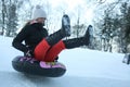 A Young Woman Sledging Down Hill Bright and Joyful Winter Scene.