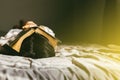 young woman sleep and holding the bible on head in morning, worship and pray.