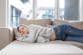 Young woman sleep resting at home on couch after a hard day`s work. Relax calm and rest. On a soft cozy comfortable sofa. Royalty Free Stock Photo