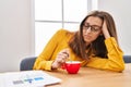 Young woman sleeped drinking coffee at office Royalty Free Stock Photo