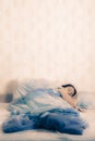 Young woman sleeping on the bed. concept of good sound sleep in a cozy bed. attractive girl lying in bed at home Royalty Free Stock Photo
