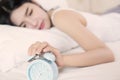 Young woman sleeping on bed f