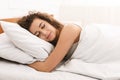 Young woman sleeping in bed in morning Royalty Free Stock Photo