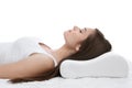 Young woman sleeping on bed with orthopedic pillow Royalty Free Stock Photo