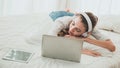 Young woman sleeping next to her laptop computer Royalty Free Stock Photo