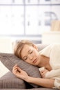 Young woman sleeping on sofa Royalty Free Stock Photo