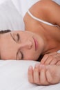 Young woman sleeping in white bed Royalty Free Stock Photo