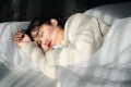 Young woman sleeping on white bed Royalty Free Stock Photo