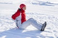 Young Woman Slips And Falls Down On Snowy Road