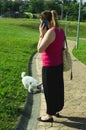 Young woman with small dog and smart phone Royalty Free Stock Photo