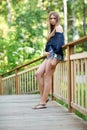 Young woman on small wooden bridge Royalty Free Stock Photo