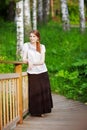 Young woman on small wooden bridge Royalty Free Stock Photo