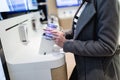 Young woman in smart phone shop