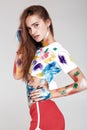 Young woman smeared in multicolored paint. Royalty Free Stock Photo