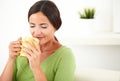 Young woman smelling a cup of coffee Royalty Free Stock Photo