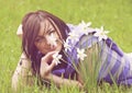 Young woman smelling daffodils Royalty Free Stock Photo