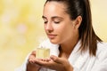Young woman smelling essential oil fragrance. Royalty Free Stock Photo