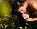 Young woman smelling flower Royalty Free Stock Photo