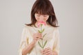 Young woman smelling flower Royalty Free Stock Photo