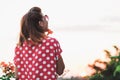 Young woman smelling flower in the garden Royalty Free Stock Photo