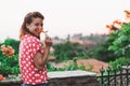 Young woman smelling flower in the garden Royalty Free Stock Photo