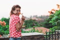 Young woman smelling flower in the garden Royalty Free Stock Photo