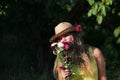 young woman smelling bunch of flowers Royalty Free Stock Photo