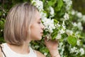 Young Woman Smelling Flowers Outdoor