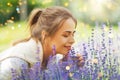 young woman smelling lavender flowers in garden Royalty Free Stock Photo