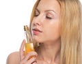 Young woman smelling perfume Royalty Free Stock Photo