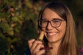 Young woman smelling red wine cork. tasting wine Royalty Free Stock Photo