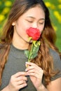 Young Woman Smelling A Rose Royalty Free Stock Photo
