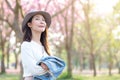 Young woman enjoying cherry blossom garden in Spring day Royalty Free Stock Photo