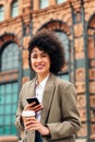 young woman smiles happy with a phone in the hand Royalty Free Stock Photo