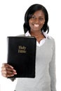Young woman smiling with a bible Royalty Free Stock Photo