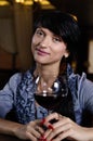 Young woman smiling while drinking red wine Royalty Free Stock Photo