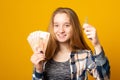 Young woman, smiling, holding car keys and Russian Ruble Royalty Free Stock Photo