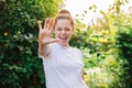 Young woman smiling outdoor. Beautiful brunete girl resting on park or garden green background. Free happy woman at Royalty Free Stock Photo